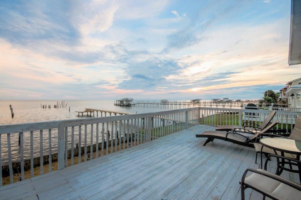 Waterfront Paradise back porch facing bay sunset