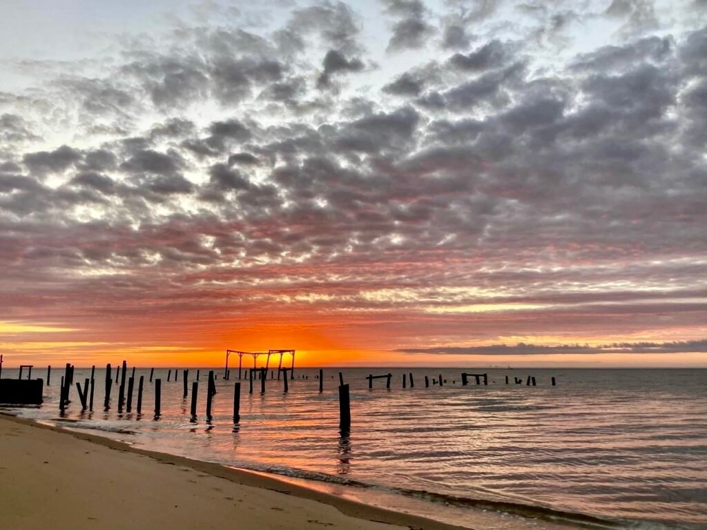 Fiery sunset over Mobile Bay near Waterfront Paradise Fairhope vacation rental