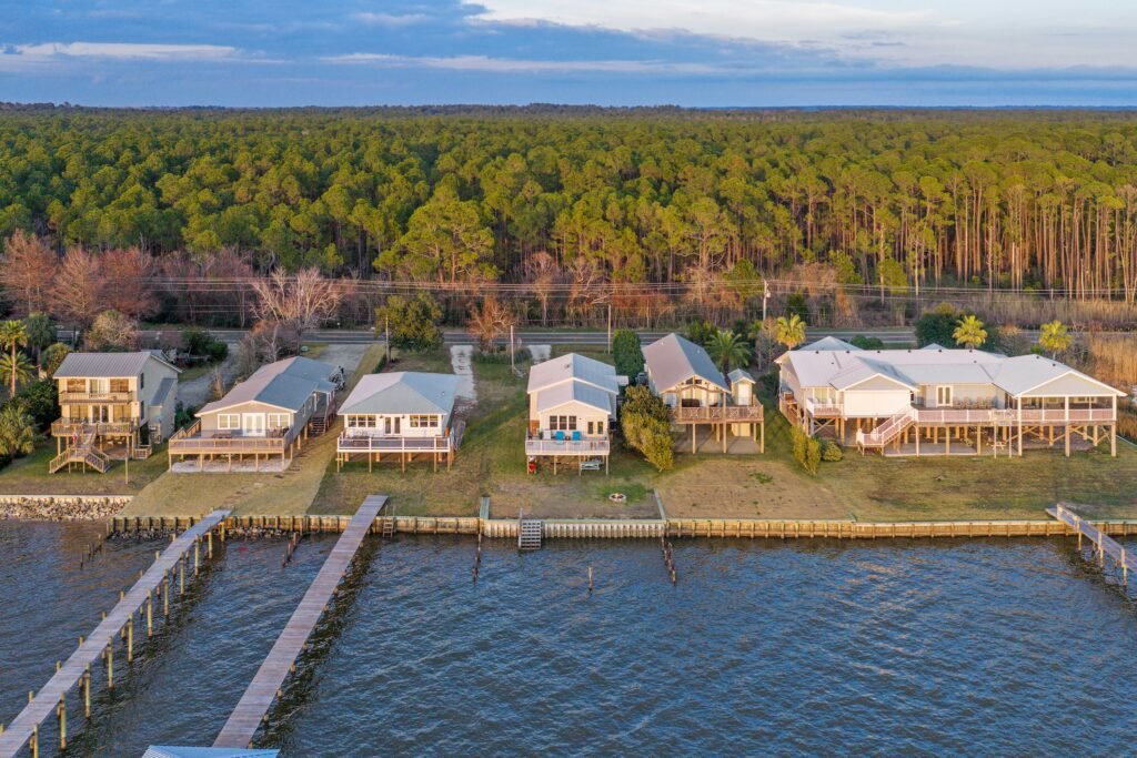 Aerial photo of bay houses and bulkheads on Mobile Bay in Fairhope Alabama on a bright, sunny day.