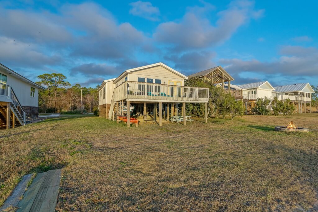 Clouds are moving in over the roofs of bay houses.