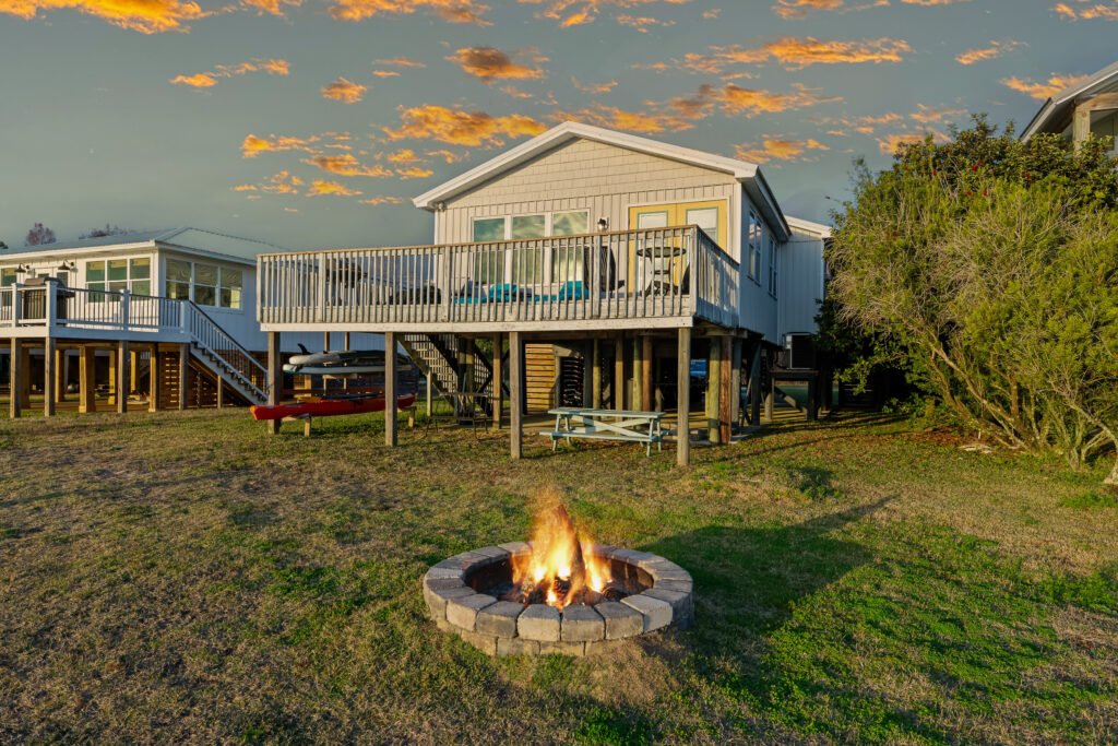 Firewood is provided for the fire pit in the backyard of this waterfront cottage.