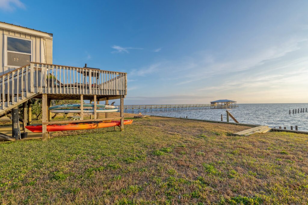 This Mobile Bay cottage rental has stairs that access the bay safely off the bulkhead.