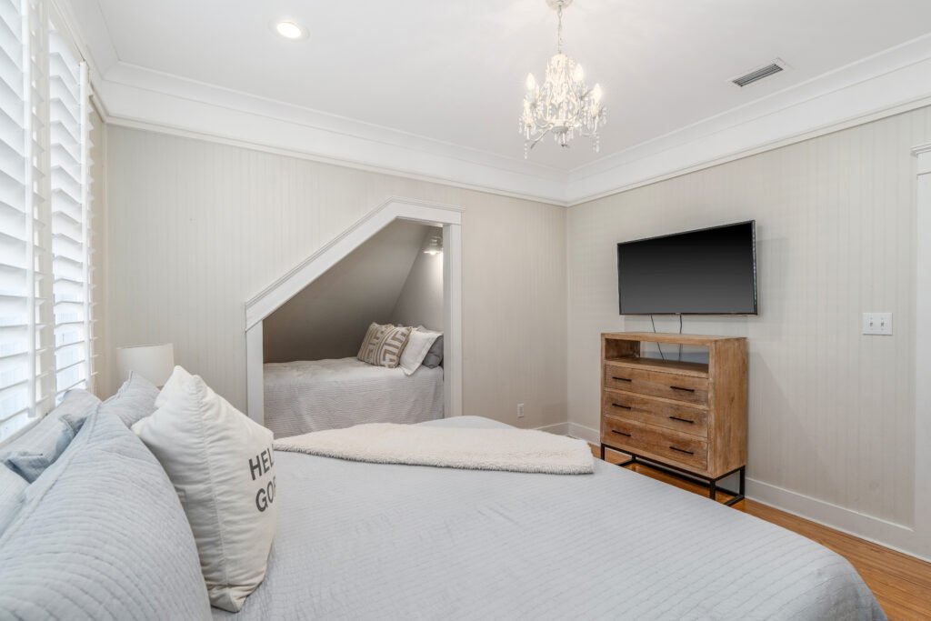 3rd bedroom located upstairs sleeps four in king bed and double bed in custom "nook", had wall mount TV and 3-drawer dresser.