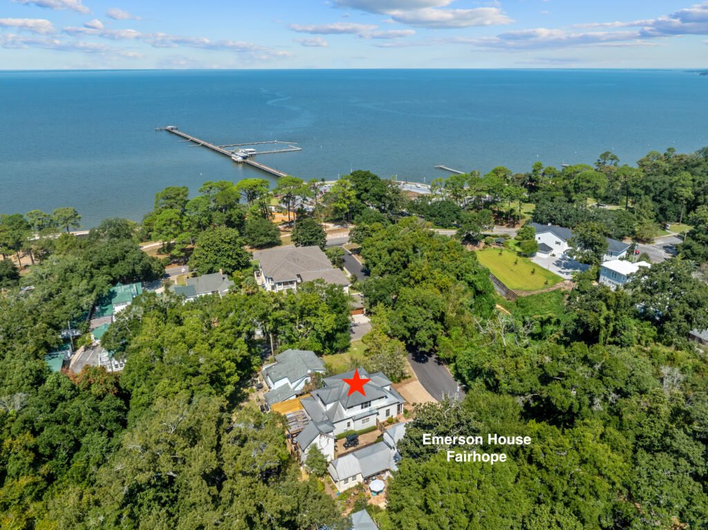 Stunning aerial view of luxury 4-bedroom cottage rental one block from Fairhope Municipal Pier on Mobile Bay.