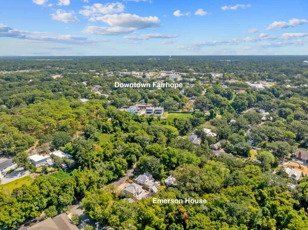 Aerial view of treelined neighborhood shows proximity of Emerson House to downtown Fairhope.