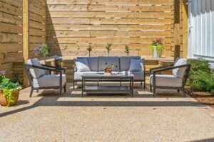 Outdoor furniture grouping with side tables on Emerson House patio