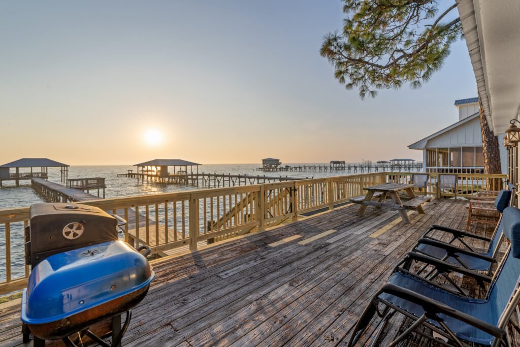 Vacation rental porch view of Mobile Bay sunset Fairhope Alabama